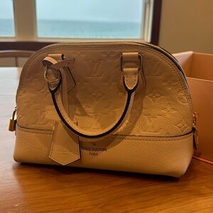 Louis Vuitton Alma bb empreinte .
